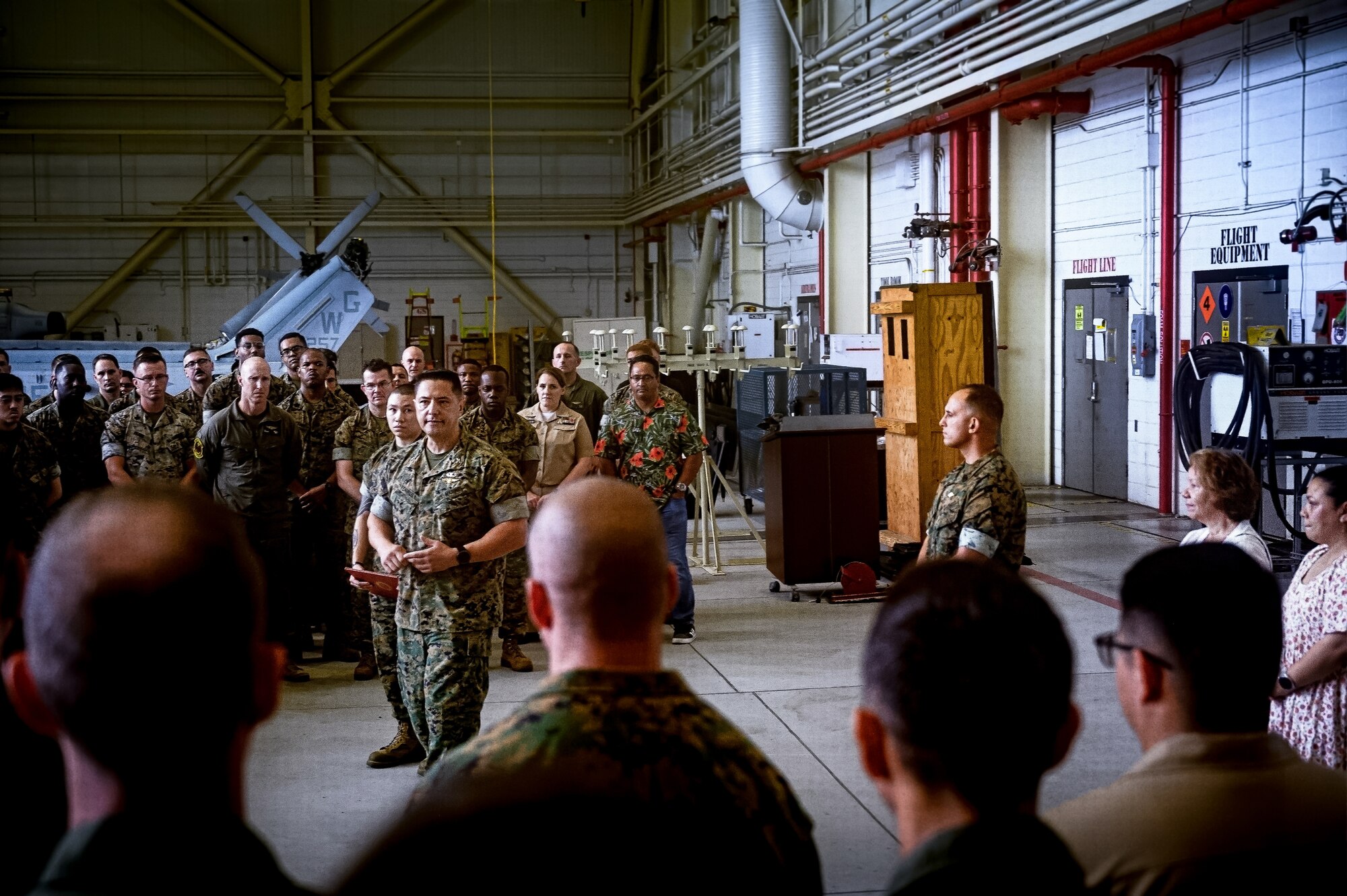 U.S. Marine Corps Col. Pablo Torres, Marine Aircraft Group 49 commanding officer, addresses an audience during an award ceremony at Joint Base McGuire-Dix-Lakehurst, N.J., Aug. 14, 2024. Gomez received the Navy and Marine Corps Medal for extricating a passenger from a burning vehicle on June 19, 2023. (U.S. Air Force photo by Senior Airman Matt Porter)