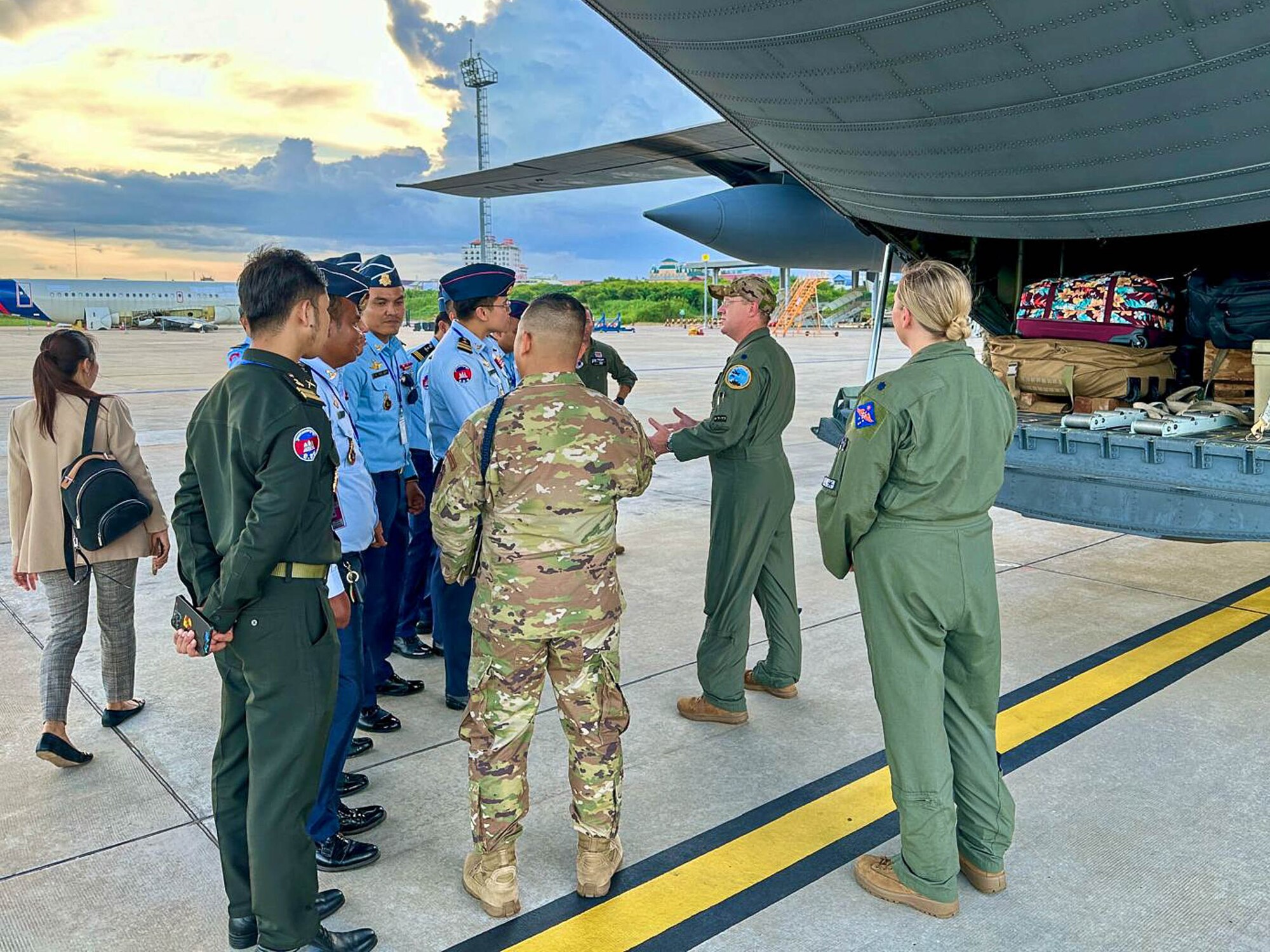 The Montana Air National Guard Airmen give Royal Cambodian Air Force officers a tour of their C-130J Hercules while it refuels at the Phnom Penh International Airport for the joint military exercise, Atlas-Angel in Phnom Penh, Cambodia.