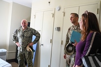 U.S. Navy Rear Admiral David Faehnle, left, commandant of Naval District Washington and U.S. Air Force Col. Ryan A.F. Crowley, commander of Joint Base Anacostia-Bolling and the 11th Wing, listen during a tour of the Furnari Hall dormitories during an Unaccompanied Housing visit at Joint Base Anacostia-Bolling, Washington, D.C., Sept. 4, 2024. Air Force and Navy leadership met to discuss the JBAB dorm conditions and plans to improve the living spaces for JBAB’s junior enlisted members. (U.S. Air Force photo by Airman 1st Class Shanel Toussaint)