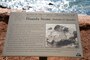 An informative sign of the historic Hauola Stone (healing stone or birthing stone) in Lahaina, Hawaii. (U.S. Army Corps of Engineers photo by Mark Haviland)