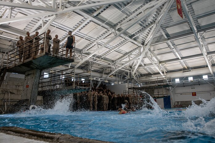 U.S. Marine Corps recruits with Delta Company, 1st Recruit Training Battalion, participate in a swim qualification event at Marine Corps Recruit Depot San Diego, California, Sept. 4, 2024. The basic swim qualification consists of a 25-meter swim, tower jump into the water, four-minute tread, 25-meter pack swim, and an underwater gear shed. (U.S. Marine Corps photo by Cpl. Sarah M. Grawcock)