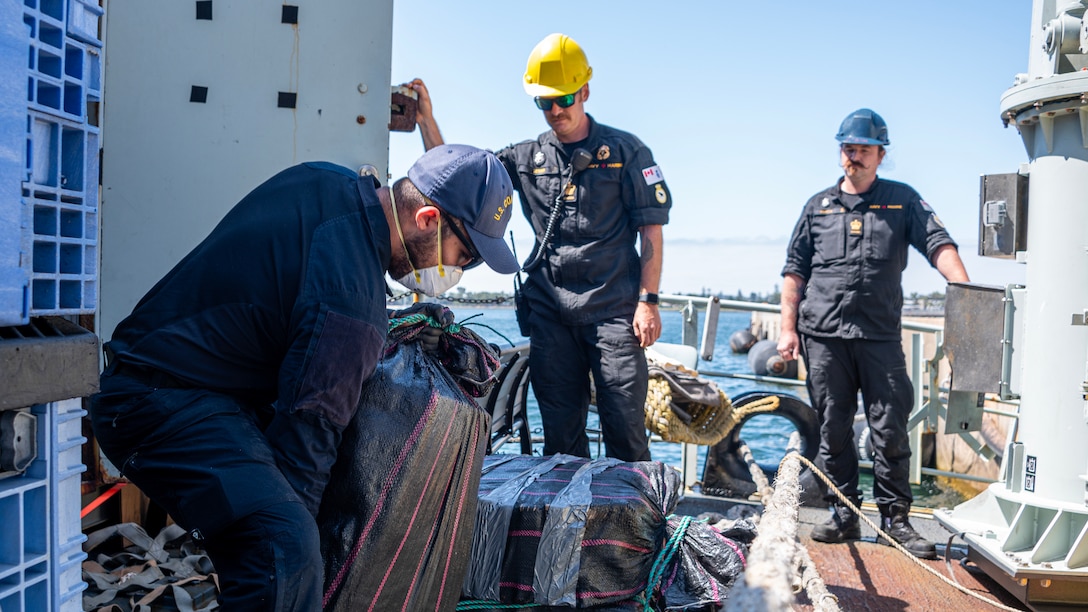 U.S. Coast Guard Capt. Timothy Lavier and Lt. Jared F. Mihalcik meet with the command of the HMCS Yellowknife, while moored in San Diego, Sept. 12, 2024.  The Royal Canadian Navy worked on patrol with a Coast Guard Law Enforcement Detachment to support the counter-narcotics mission. (U.S. Coast Guard photo by Petty Officer 3rd Class Richard Uranga/Released)