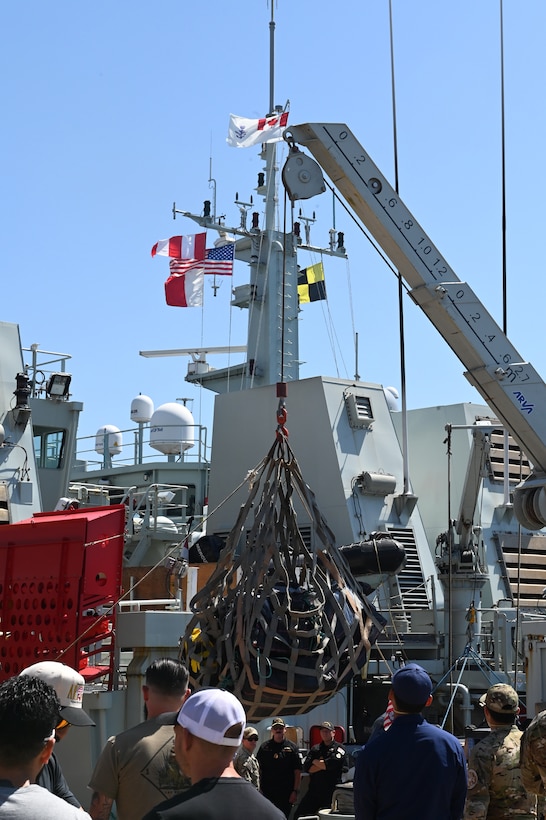 U.S. Coast Guard Capt. Timothy Lavier and Lt. Jared F. Mihalcik meet with the command of the HMCS Yellowknife, while moored in San Diego, Sept. 12, 2024.  The Royal Canadian Navy worked on patrol with a Coast Guard Law Enforcement Detachment to support the counter-narcotics mission. (U.S. Coast Guard photo by Petty Officer 3rd Class Richard Uranga/Released)