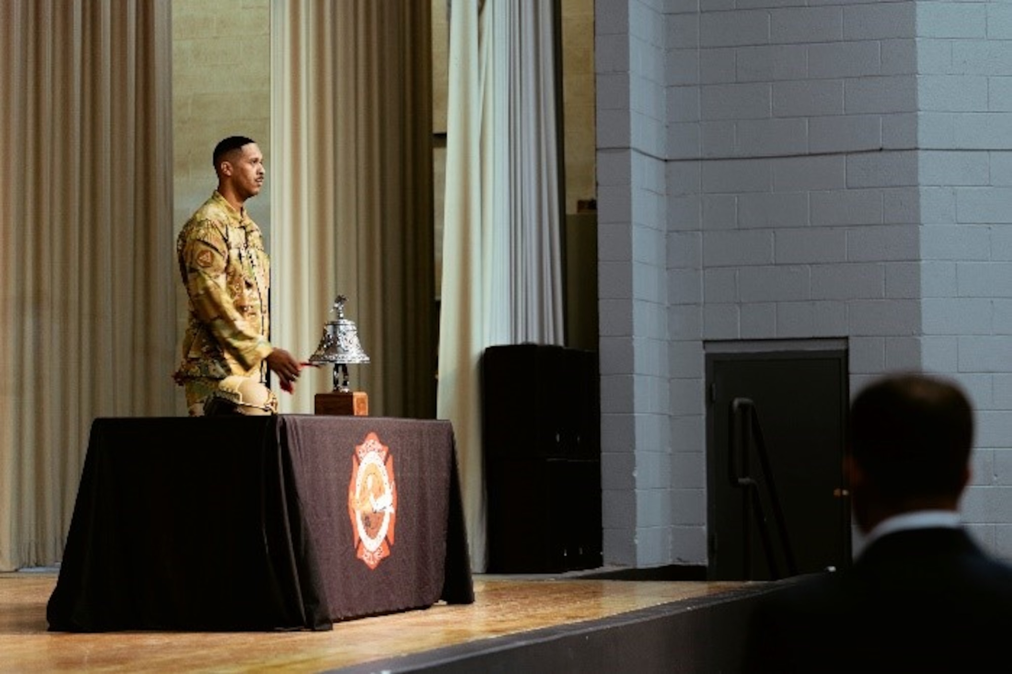 A Firefighter with the 812th Civil Engineer Squadron fire and emergency services sounded a series of bells known as “Striking the Four Fives” to remember and honor the fallen firefighters from 9/11.