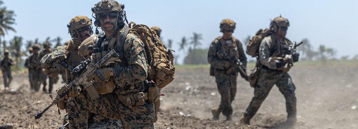 U.S. Marines with Alpha Company, 1st Battalion, 1st Marine Regiment, 1st Marine Division, move to an objective during an amphibious assault exercise as part of Super Garuda Shield 2024 near Banongan, Indonesia, Sept. 5, 2024.