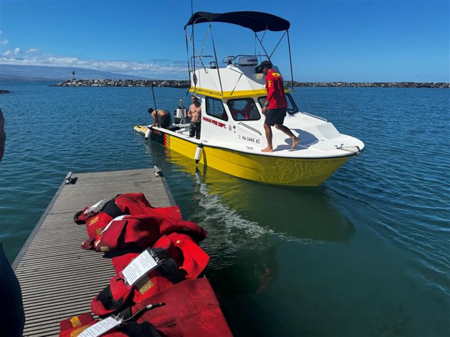 Members from Hawai'i Fire Department prepare to dock after completing a search and rescue exercise off Kawaihae, Hawai'i, Sep. 12, 2024.