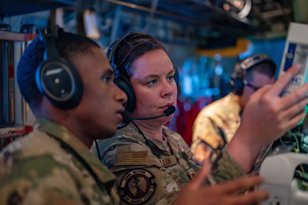 Tech. Sgt. Terrance Russell and Capt. Emily Mallon read information from an IVAC Triple Channel IV pump