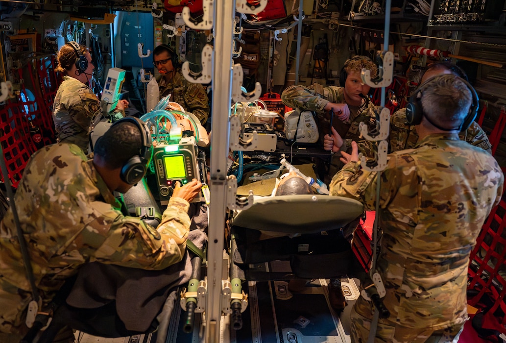 Airmen assigned to the 920th Aeromedical Staging Squadron Critical Care Air Transport Team perform medical care