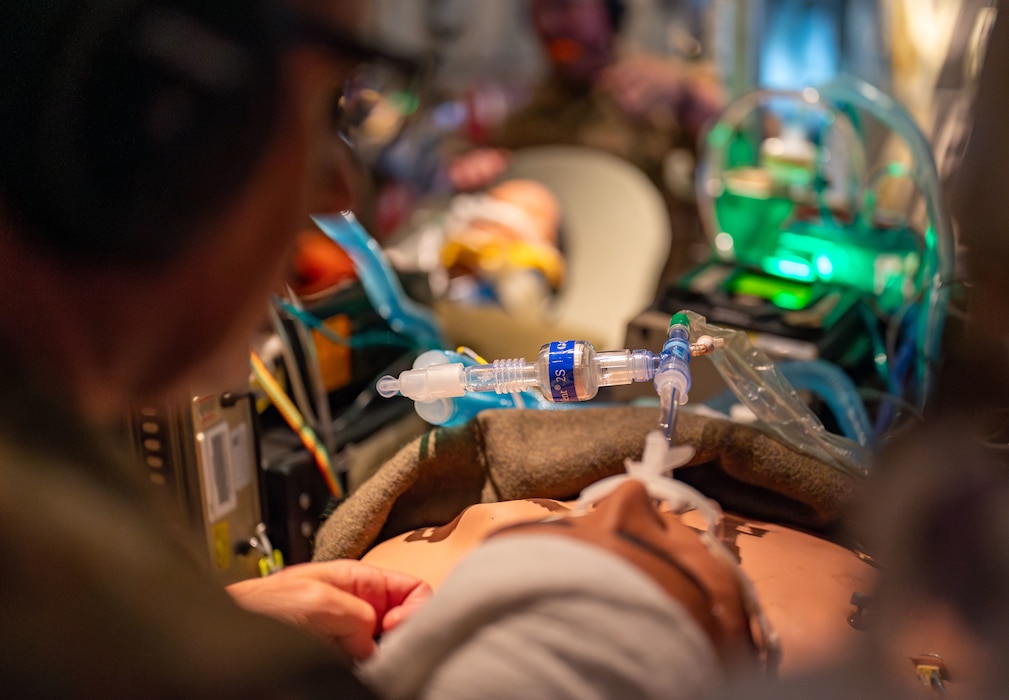 Airmen assigned to the 920th Aeromedical Staging Squadron Critical Care Air Transport Team perform an endotracheal intubation on a high-fidelity mannequin