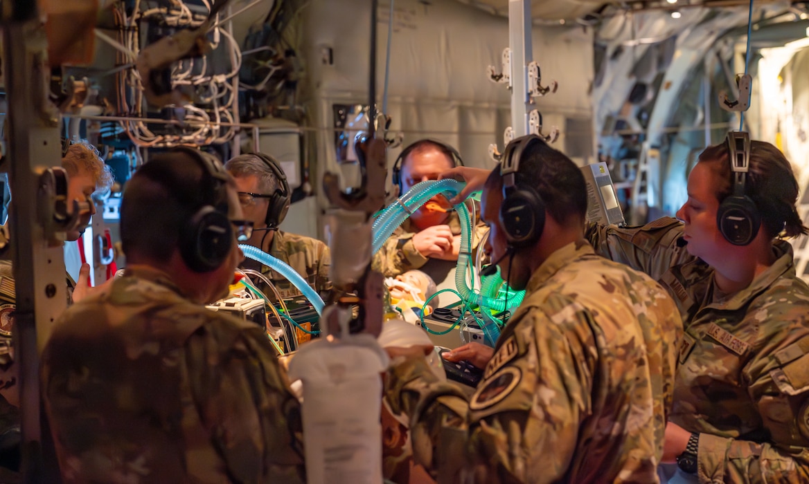 Airmen assigned to the 920th Aeromedical Staging Squadron Critical Care Air Transport Team perform medical care