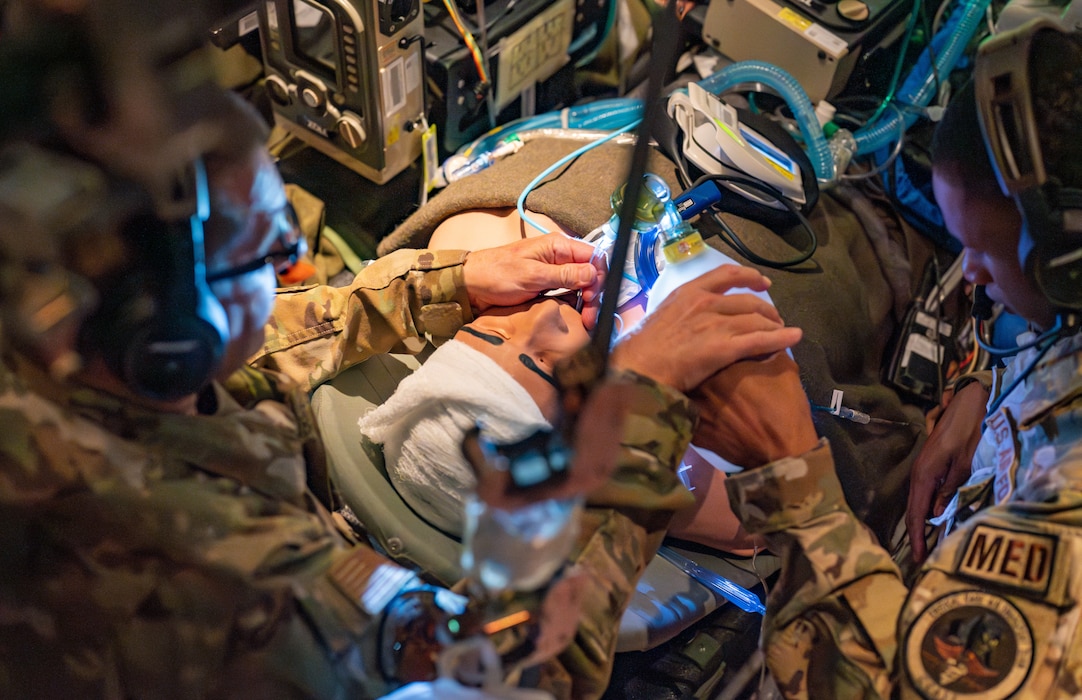 Airmen assigned to the 920th Aeromedical Staging Squadron Critical Care Air Transport Team perform an endotracheal intubation on a high-fidelity mannequin