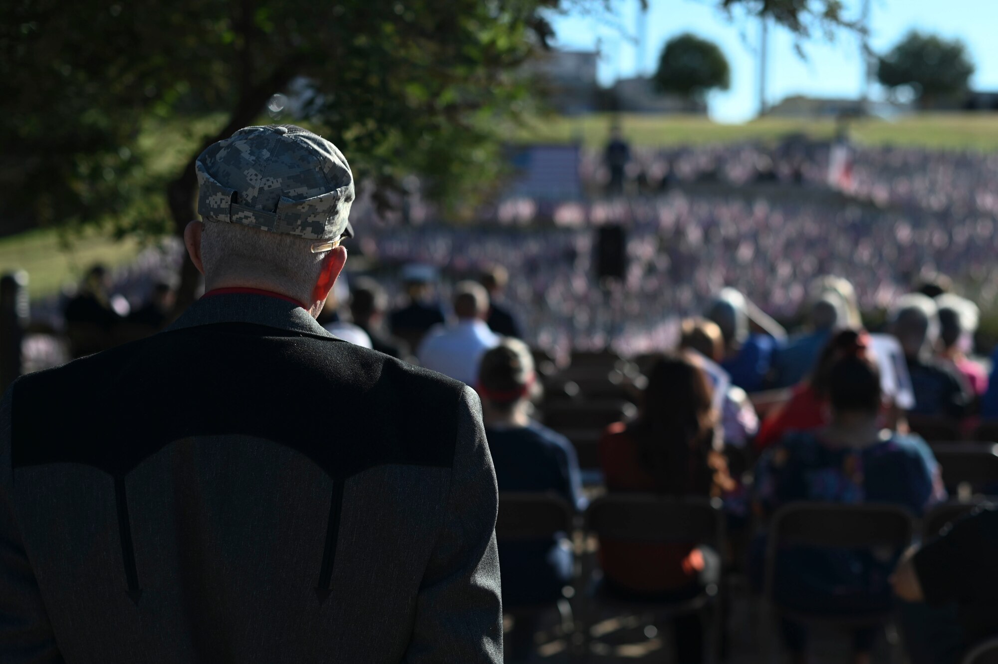 An attendee listens to speeches given during the annual San Angelo 9/11 remembrance, San Angelo, Texas, Sept. 11, 2024. Civic leaders, veterans and residents came together in unity to honor the lives lost during the Sept. 11, 2001 terrorist attacks. (U.S. Air Force photo by Senior Airman Ethan Sherwood)