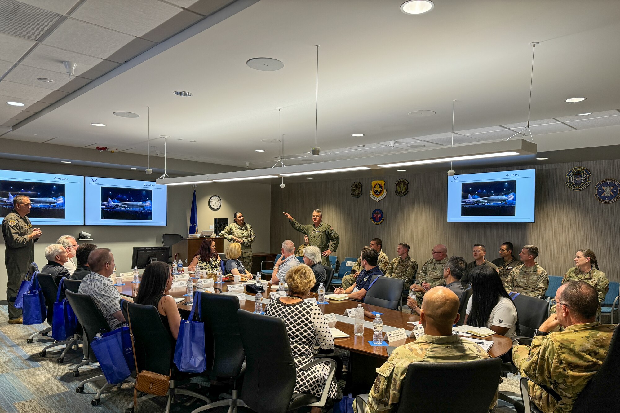 U.S. Air Force Maj. Gen. D. Scott Durham, standing right, commander, Fourth Air Force, Air Force Reserve Command (AFRC), speaks to AFRC civic leaders and AFRC leadership during a tour of the 452nd Air Mobility Wing, March Air Reserve Base, California, Sept. 6, 2024. Lt. Gen. John Healy, commander of the AFRC and chief of the Air Force Reserve (AFR), hosted a two-day civic leader tour to Nellis Air Force Base, Nevada and March Air Reserve Base, California to provide familiarization and education about the AFR mission and help the civic leaders from across the nation get an up-close and personal view of some of the transformative initiatives happening within the command. (U.S. Air Force photo by Roger Parsons)