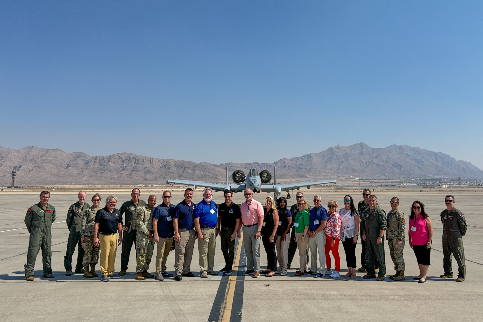 U.S. Air Force Reserve Command (AFRC) civic leaders and AFRC leaders stand in front of an A-10 Thunderbolt II during a tour of the 926th Wing, Nellis Air Force Base, Nevada, Sept. 5, 2024. Lt. Gen. John Healy, commander of the AFRC and chief of the Air Force Reserve (AFR), hosted a two-day civic leader tour to Nellis Air Force Base, Nevada and March Air Reserve Base, California to provide familiarization and education about the AFR mission and help the civic leaders from across the nation get an up-close and personal view of some of the transformative initiatives happening within the command. (U.S. Air Force photo by Roger Parsons)