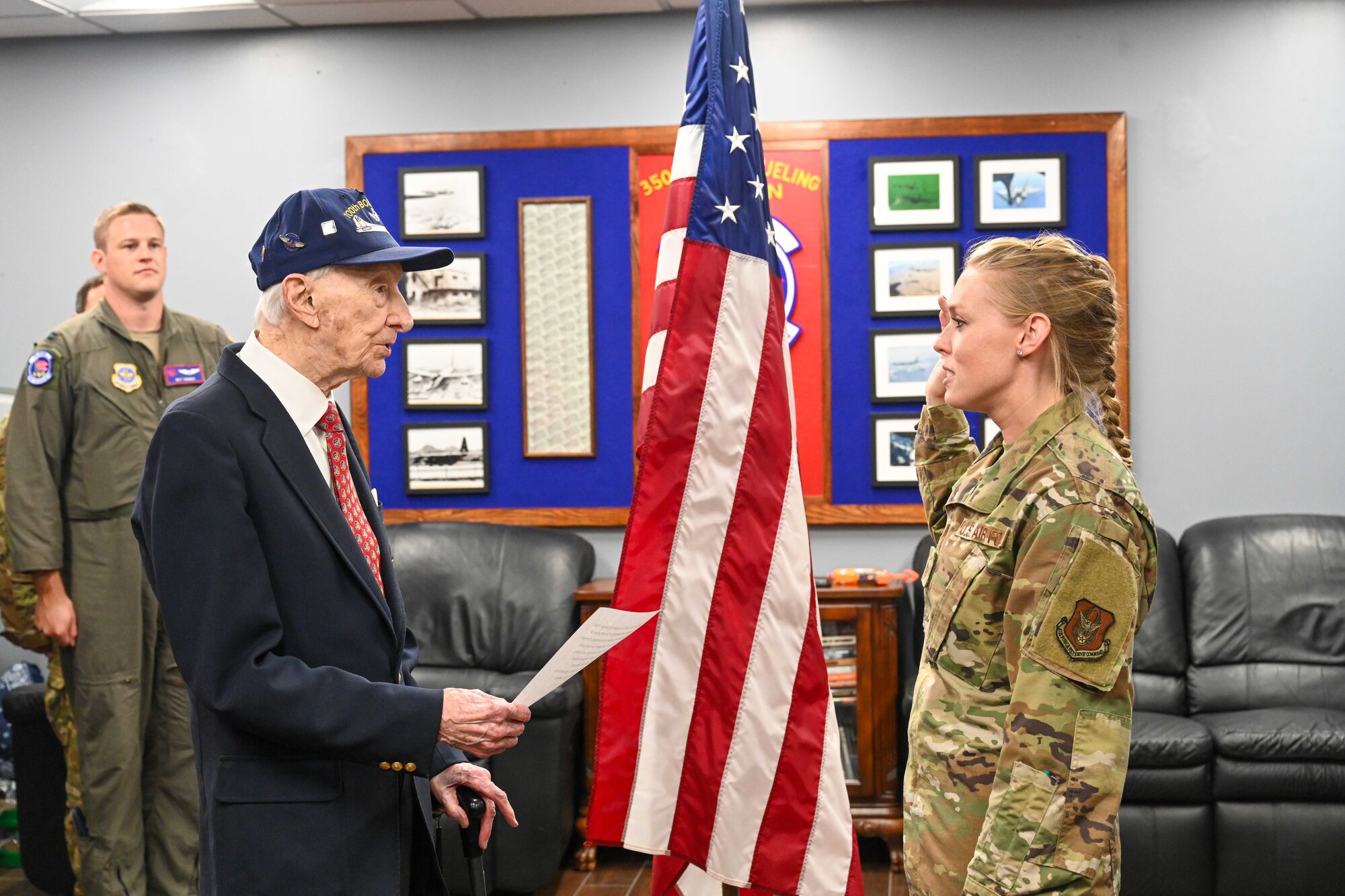 Retired Maj. John “Lucky” Luckadoo conducts a reenlistment ceremony during his visit Sept. 6, 2024, at McConnell Air Force Base, Kansas. Luckadoo was stationed at McConnell during World War II in the 350th Bomb Squadron. The visit reminded future generations of the sacrifices made by his generation. (U.S. Air Force photo by Senior Airman William Lunn)