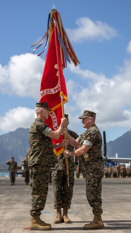 U.S. Marine Corps Lt. Gen. James F. Glynn, left, incoming commander, receives the colors from Lt. Gen. William M. Jurney, outgoing commander, both with U.S. Marine Corps Forces, Pacific, during the MARFORPAC change of command ceremony on Marine Corps Base Hawaii, Sept. 12, 2024.  With two-thirds of the Marine Corps operating forces assigned, MARFORPAC operates in the U.S. Indo-Pacific Command area of responsibility, the largest Geographical Combatant Command in the U.S. Department of Defense, as the Nation’s expedition force and like-minded allies and partners to preserve and maintain a free and open Indo-Pacific region. (U.S. Marine Corps photo by Staff Sgt. Ash McLaughlin)