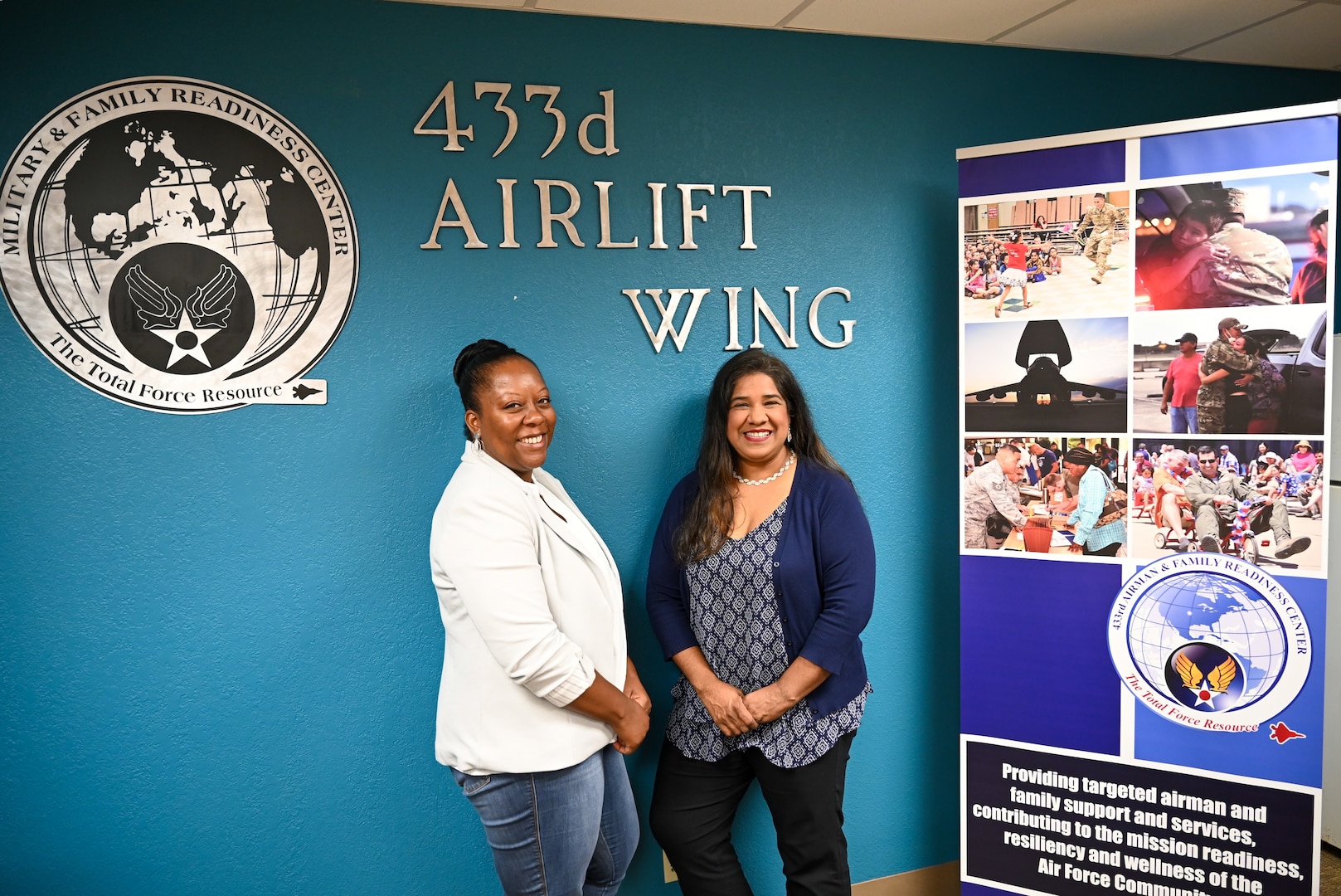 Leticia Gonzalez, 433rd Airlift Wing Military and Family Readiness program manager, poses alongside Nakia Evans, Magellan Federal personal financial counselor, for a photo to showcase the Military and Family Readiness and their programs in their conference room.