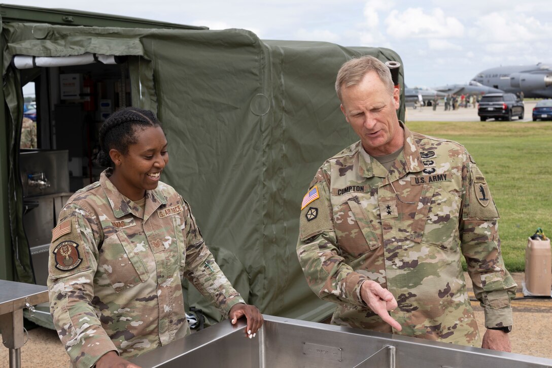 Air Force member, left, gives a tour to Missouri Adjutant General of the E-SPEK