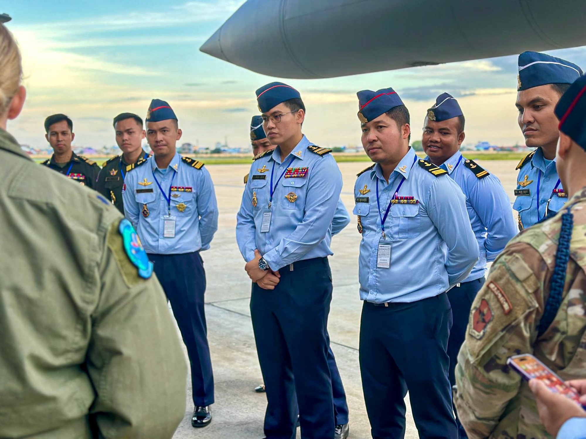 Royal Cambodian Air Force officers listen to Montana Air National Guard Airmen explain the mission of the joint exercise, Atlas Angel, while the unit’s C-130J Hercules refuels at the Phnom Penh International Airport in Phnom Penh, Cambodia.