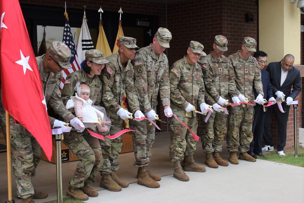 Lt. Gen. Christopher LaNeve (fifth from right), Eighth Army commander; Col. Ryan Workman (fourth from right), U.S. Army Garrison Humphreys commander; Col. Jeremiah Willis (third from right), U.S. Army Corps of Engineers – Far East District commander; and other distinguished guests cut the ribbon for three new housing towers, Camp Humphreys, South Korea, Sept. 13, 2024.