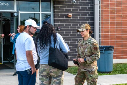 U.S. Airman 1st Class Isabella D’Alessandro, an aerospace medical service Airman assigned to the Ohio National Guard’s 180th Fighter Wing, helps a family through the registration process before they enter the Greene County Career Center for Guard Care in Xenia, Ohio, Aug. 11, 2024. Guard members helped provide free health care as part of the Department of Defense Innovative Readiness Training program.