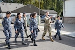 Washington Army National Guard Chief Warrant Officer 2 Kristin Retherford, 10th Civil Support Team survey team leader, gives Royal Thai Air Force officers a tour of the 10th CST facilities during a State Partnership Program engagement Sept. 11, 2024, at Camp Murray, Wash. The tour was part of the first female leadership-focused exchange with RTAF since Washington’s formal relationship with the Kingdom of Thailand began in 2002.