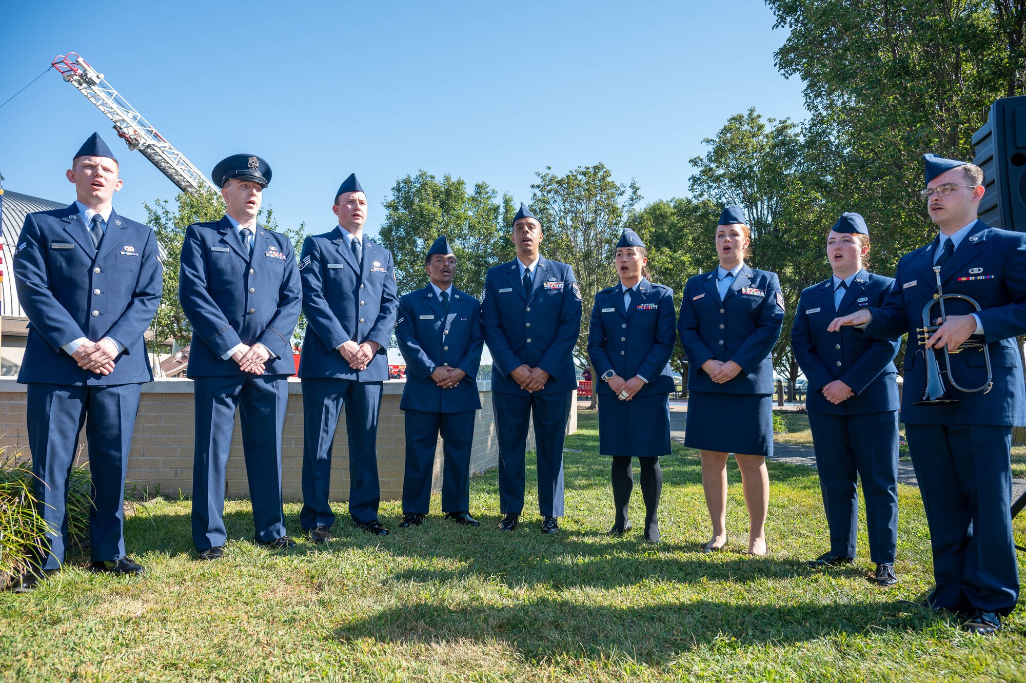 The Dover Air Force Base Eagle Choir sing the national anthem during the 23rd Anniversary 9/11 Memorial Service at the Air Mobility Command Museum on Dover Air Force Base, Delaware, Sept. 11, 2024. Members of Team Dover along with local firefighter communities paid respect to the victims of 9/11 and participated in the memorial. (U.S. Air Force photo by Mauricio Campino)