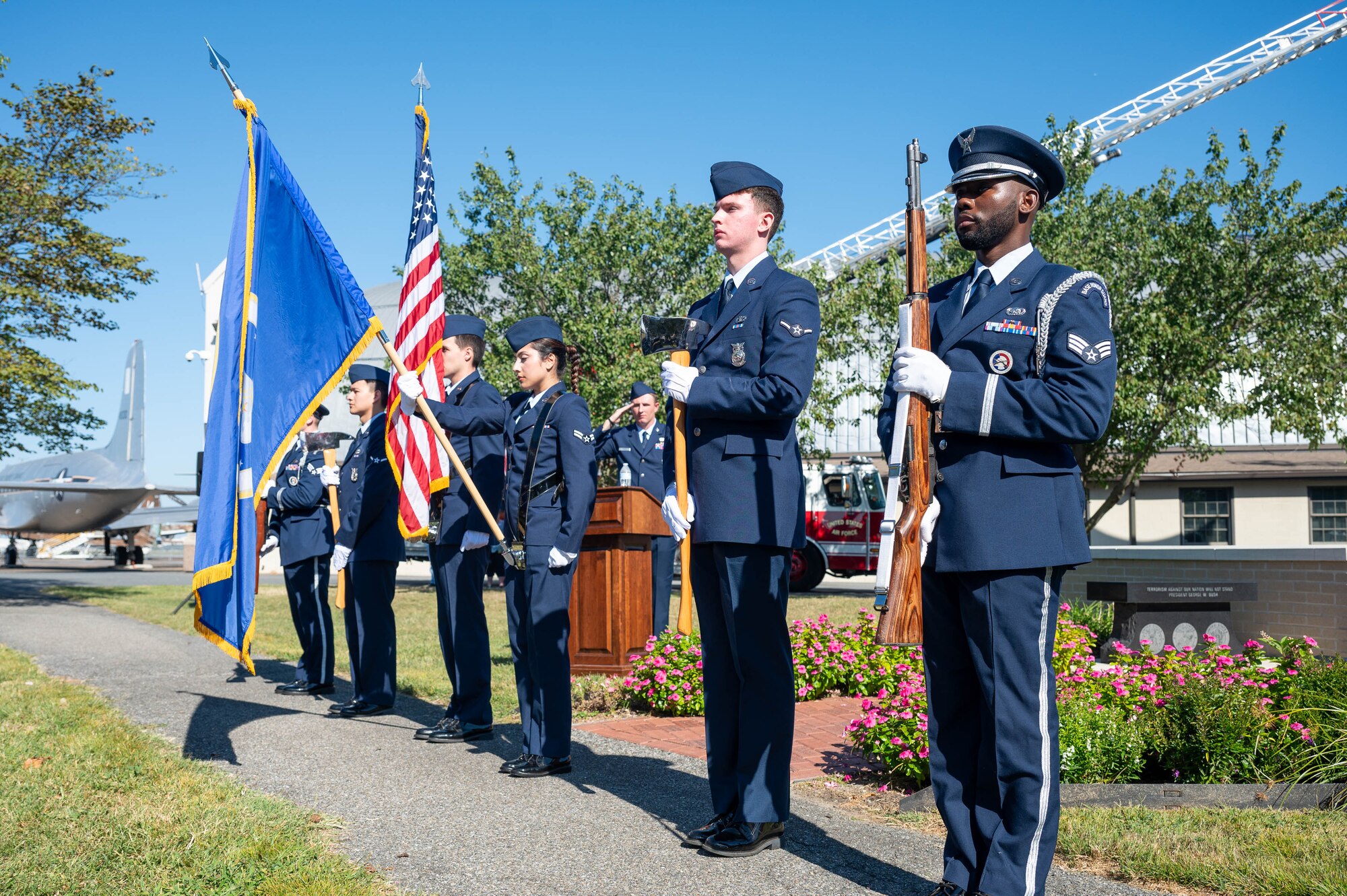 The Dover Air Force Base Emergency Services Joint Honor Guard, presents the American flag during the 23rd Anniversary 9/11 Memorial Service at the Air Mobility Command Museum on Dover AFB, Delaware, Sept. 11, 2024. The memorial service honored the civilian casualties of the terrorist attacks as well as the police officers, firefighters and emergency first responders that lost their lives. (U.S. Air Force photo by Mauricio Campino)