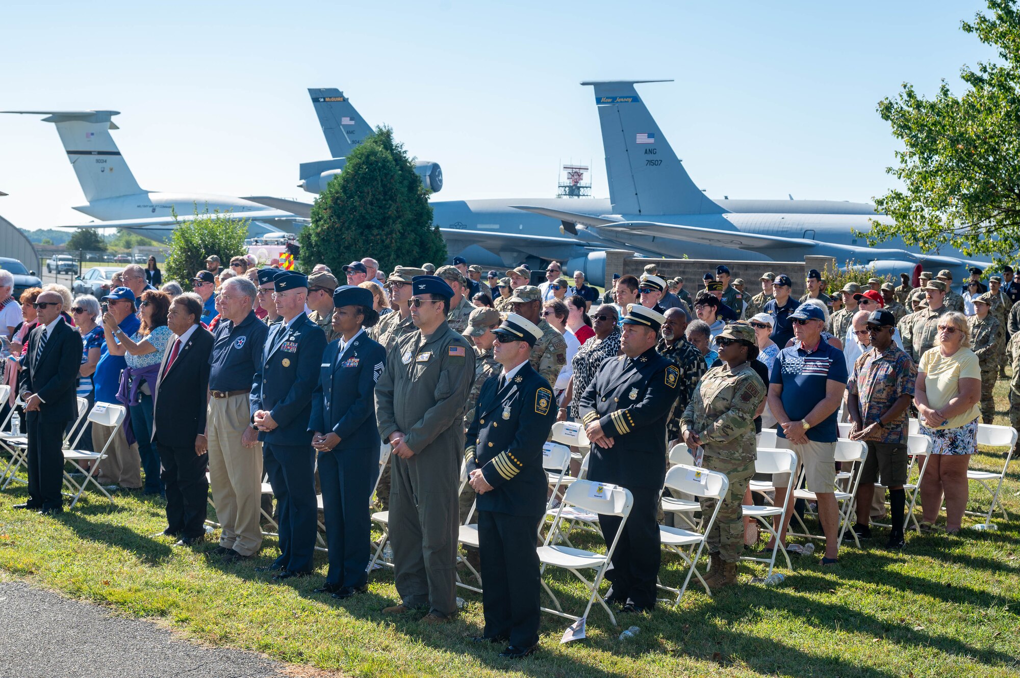 Members of Team Dover and first responders stand during the invocation prayer at the 23rd Anniversary 9/11 Memorial Service at the Air Mobility Command Museum on Dover Air Force Base, Delaware, Sept. 11, 2024. The memorial service honored the civilian casualties of the terrorist attacks as well as the police officers, firefighters and emergency first responders that lost their lives. (U.S. Air Force photo by Mauricio Campino)