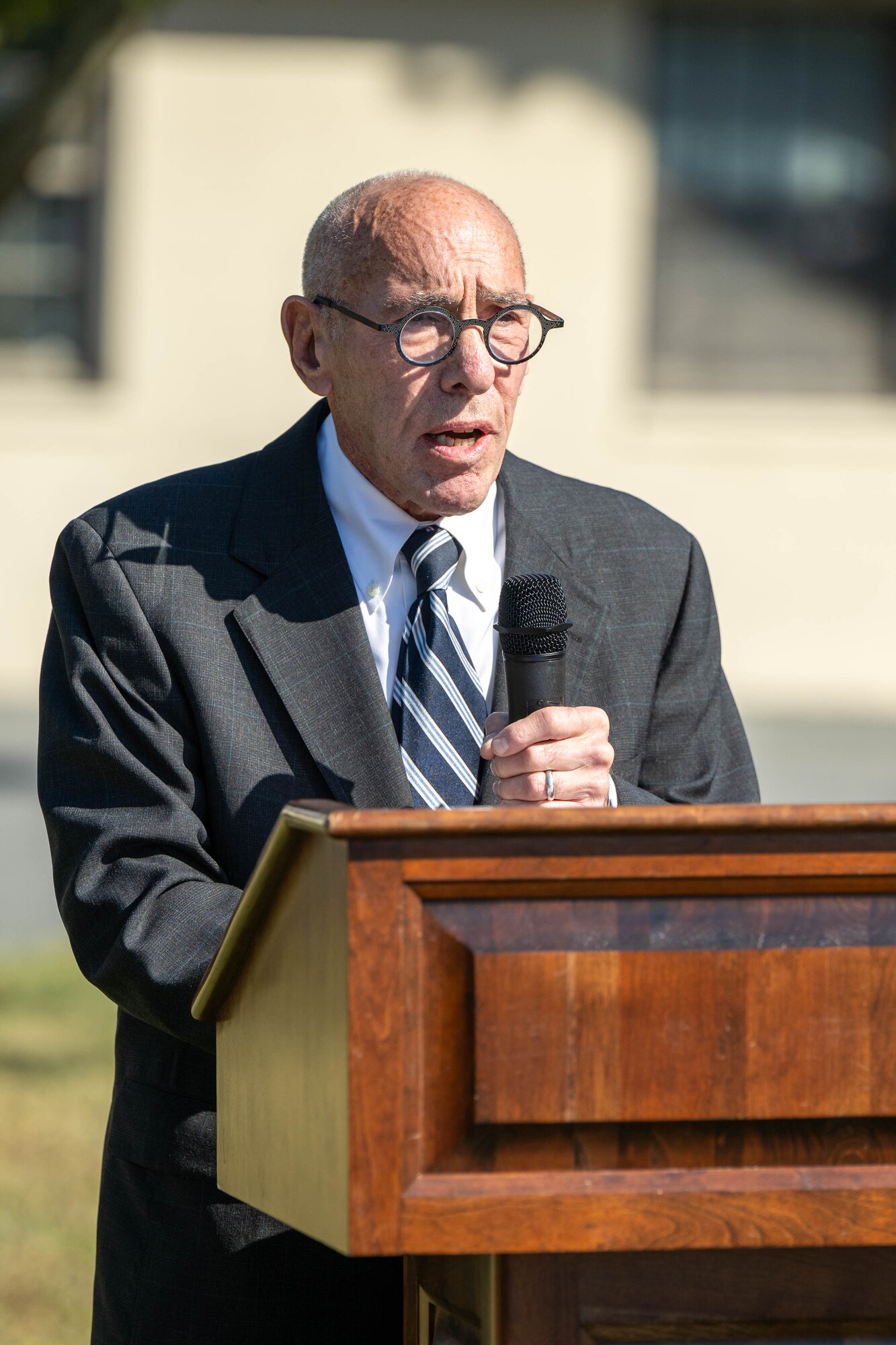 William Raf, a survivor of the 9/11 attacks, speaks at the 23rd Anniversary 9/11 Memorial Service at the Air Mobility Command Museum on Dover Air Force Base, Delaware, Sept. 11, 2024. Raf was on the 82nd floor of  the South Tower when the plane struck the building. (U.S. Air Force photo by Mauricio Campino)
