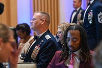 U.S. Air Force Maj. Gen. Daniel A. DeVoe, commander of the Air Force District of Washington and the 320th Air Expeditionary Wing at Joint Base Andrews, Maryland, listens to a congratulatory speech during the SNCO Induction ceremony at MGM Grand in Oxon Hill, Maryland, Sept. 7, 2024. More than 600 AFDW senior enlisted members were in attendance for the event. (U.S. Air Force photo by Airman 1st Class Shanel Toussaint)