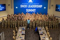U.S. Air Force Retired Chief Master Sgt. of the Air Force Kaleth O. Wright, poses with over 100 senior noncommissioned officers at their final brief during the National Capital Region SNCO Summit at the Smart Center on Joint Base Andrews, Maryland, Sept. 6, 2024. The summit provided an in-depth briefing on the upcoming promotionary rank, outlining the expectations and responsibilities that come with the promotion. (U.S. Air Force photo by Airman 1st Class Shanel Toussaint)