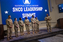 U.S. Air Force Airmen stand for recognition of their contribution to the event coordination of the National Capital Region SNCO Summit at the Smart Center on Joint Base Andrews, Maryland, Sept. 6, 2024. The summit provided an in-depth briefing on the upcoming promotionary rank, outlining the expectations and responsibilities that come with the promotion. (U.S. Air Force photo by Airman 1st Class Shanel Toussaint)