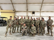 CW2 Michael Yoha with members of the Maintenance Platoon of the 113th Transportation Company