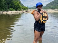 Staff Sgt. Julia Vickers in the adaptive reconditioning event of white-water rafting