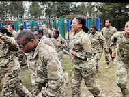 Spc. Dominique Washington during PT