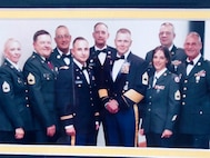 Sgt 1st Class Lisa Smith with her team at Fort Riley