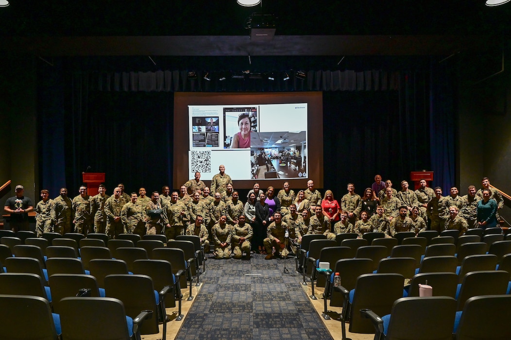 People pose for a photo.