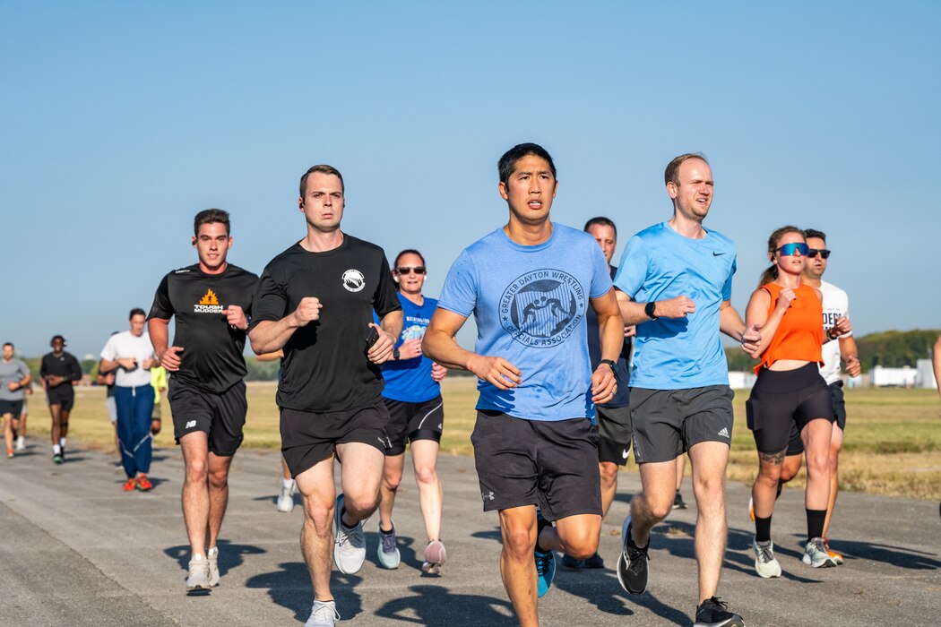 A group of runners moving forward in the direction of the viewer