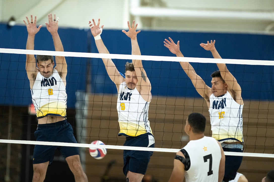 Navy defenders go up for the block during the 2024 Armed Forces Men’s and Women’s Volleyball Championship held at Fort Carson, Colorado 10-14 September.  Teams from the Army, Navy (with Marine Corps and Coast Guard players) and Air Force (with Space Force players) battle it out for gold.  (DoD photo by EJ Hersom)