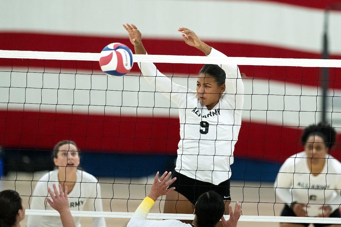 Army 1st Lt. Monica Eckford of Fort Cavazos, Texas denies the spike during tThe 2024 Armed Forces Men’s and Women’s Volleyball Championship held at Fort Carson, Colorado 10-14 September.  Teams from the Army, Navy (with Marine Corps and Coast Guard players) and Air Force (with Space Force players) battle it out for gold.  (DoD photo by EJ Hersom)