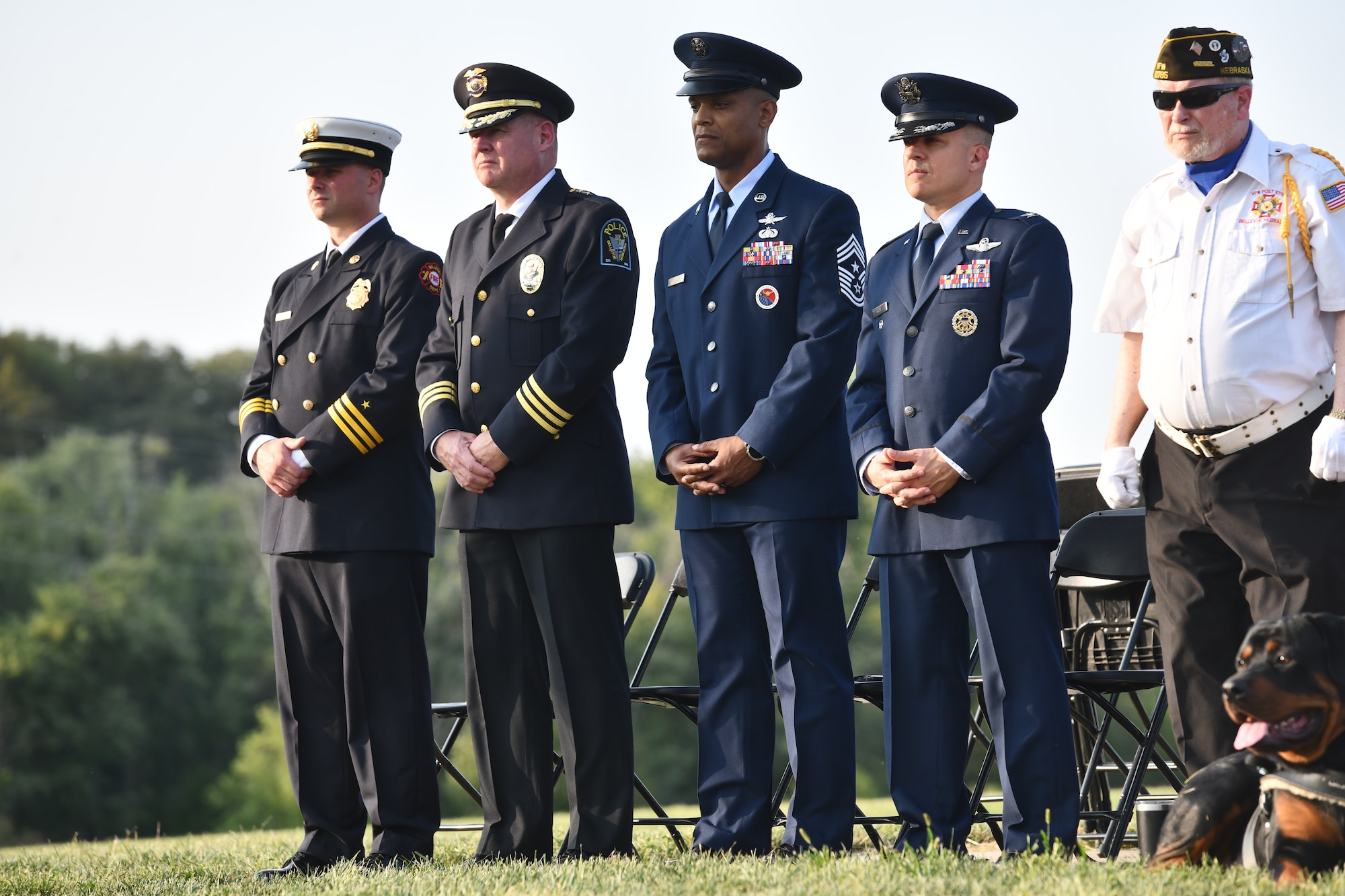 Battalion Commander Jeremy Zink of the Bellevue Fire Department, Chief Ken Clary of the Bellevue Police Department, Chief Master Sgt. Andrew Small, 55th Wing command chief and Col. Aaron Gray, 55th Wing deputy commander, stand at the 9/11 memorial service at American Heroes Park in Bellevue, Neb. on Sept. 11, 2024.(U.S. Air Force photo by Chad Watkins)