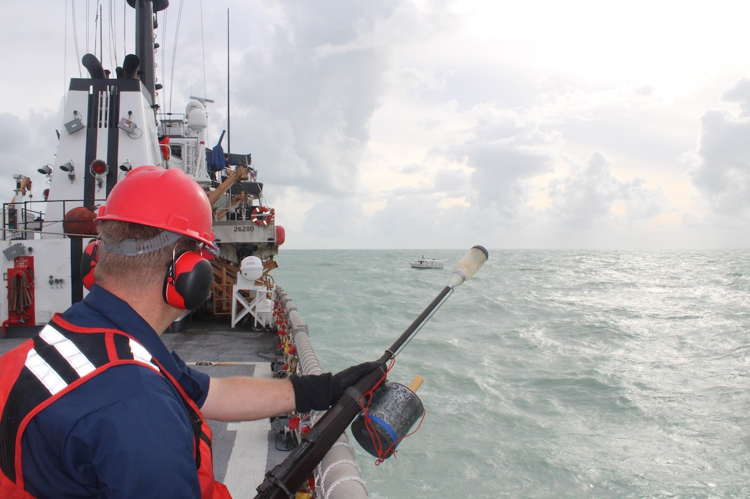 Coast Guard Cutter Diligence (WMEC 616) crew members assist a disabled fishing vessel in distress during Hurricane Debby, Aug. 5, 2024, while underway in the Florida Straits. Diligence's crew conducted maritime safety and security missions during a 41-day patrol in the Florida Straits and Windward Passage. (U.S. Coast Guard photo by Ensign Christina Liano Mock)