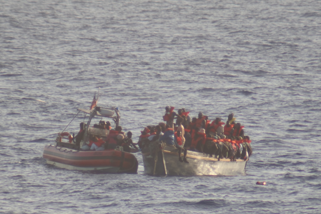 Crew members from the U.S. Coast Guard Cutter Diligence (WMEC 616) interdict one Dominican and 182 Haitian migrants from an adrift 40-foot vessel, Aug. 18, 2024, approximately 50 nautical miles north of Haiti. Diligence's crew conducted maritime safety and security missions during a 41-day patrol in the Florida Straits and Windward Passage. (U.S. Coast Guard photo by Petty Officer 3rd Class William Covert)