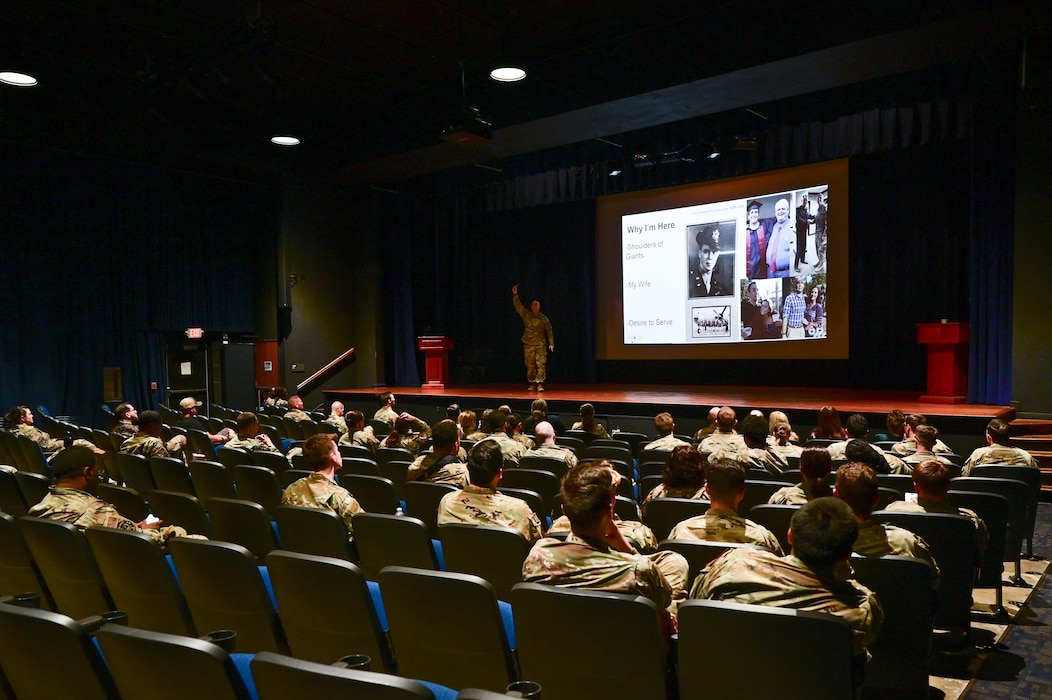 People sit in an audience.