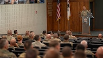 Illinois State Command Chief Warrant Officer 5 Thomas Black speaks to the approximately 100 warrant officers in attendance at the Illinois National Guard Warrant Officer Symposium on Camp Lincoln in Springfield, Illinois Sept. 12.