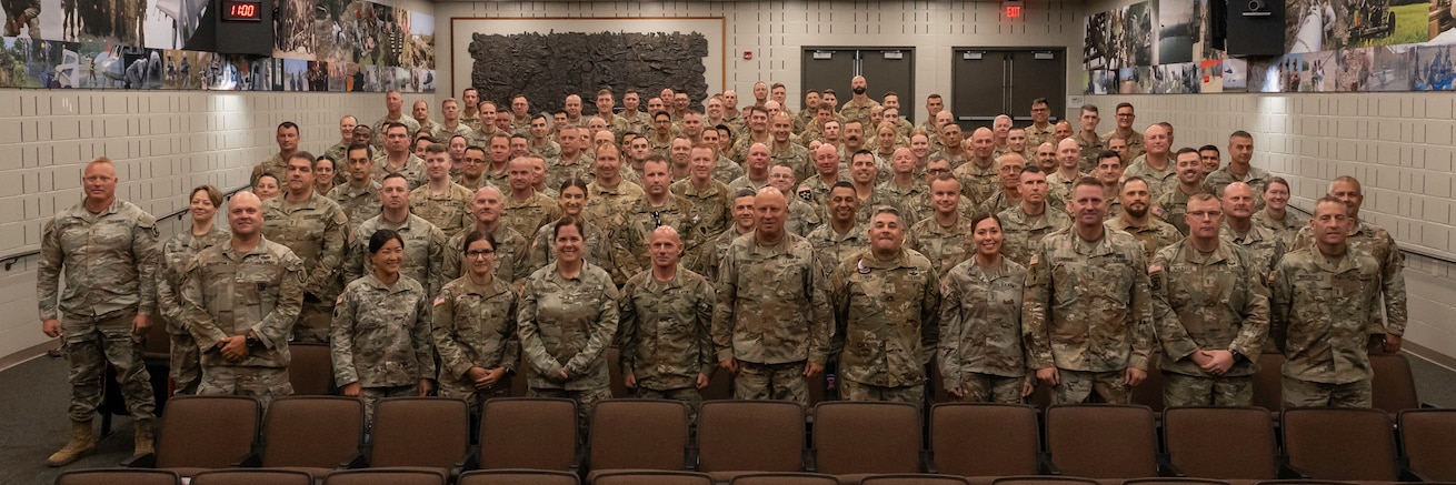 Approximately 100 Illinois Army National Guard warrant officers pose for a photo while in attendance at the Illinois National Guard Warrant Officer Symposium on Camp Lincoln in Springfield, Illinois Sept. 11-12.