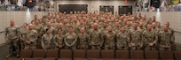 Approximately 100 Illinois Army National Guard warrant officers pose for a photo while in attendance at the Illinois National Guard Warrant Officer Symposium on Camp Lincoln in Springfield, Illinois Sept. 11-12.