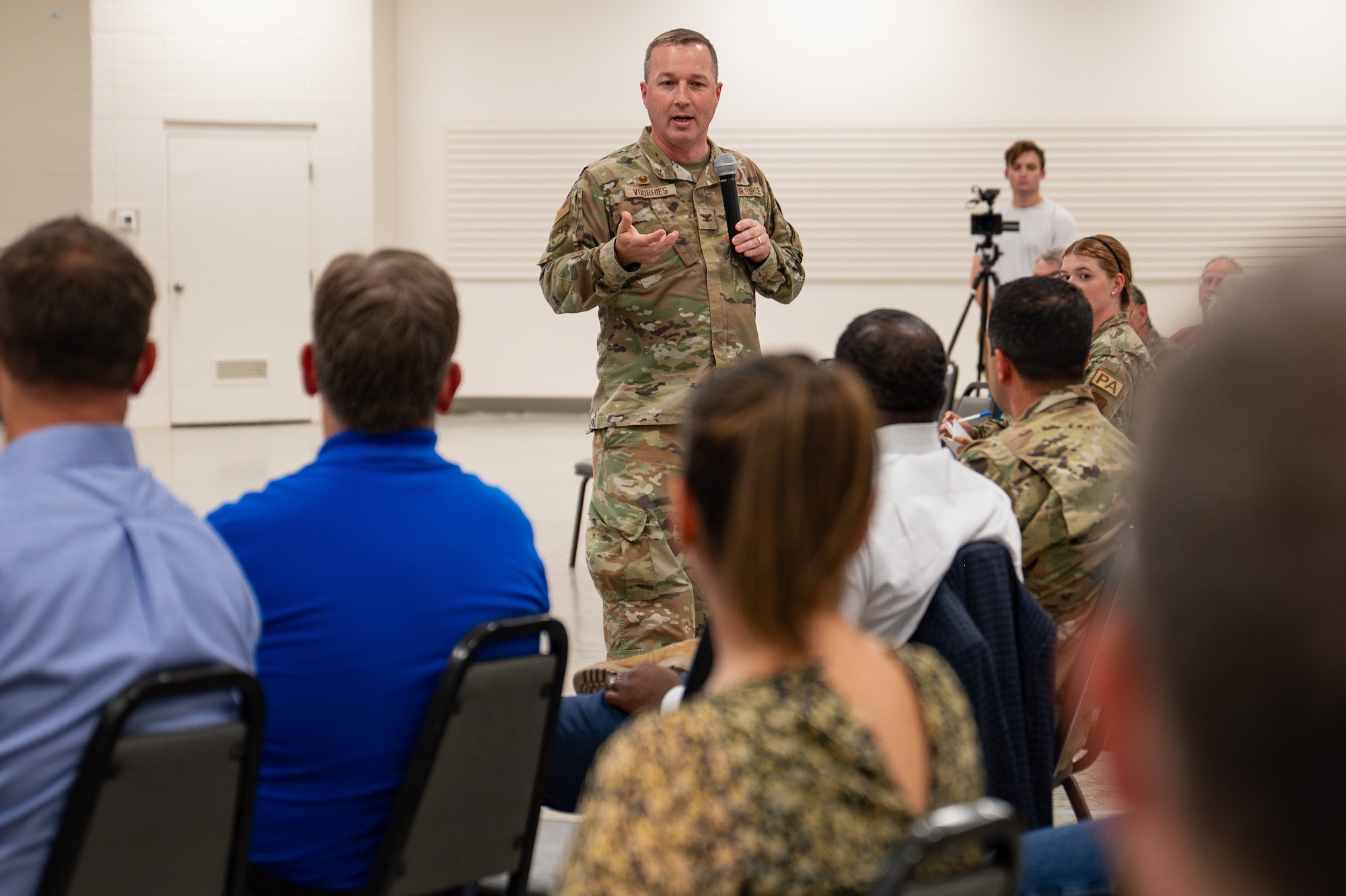 Uniformed personnel interact with members of the community.