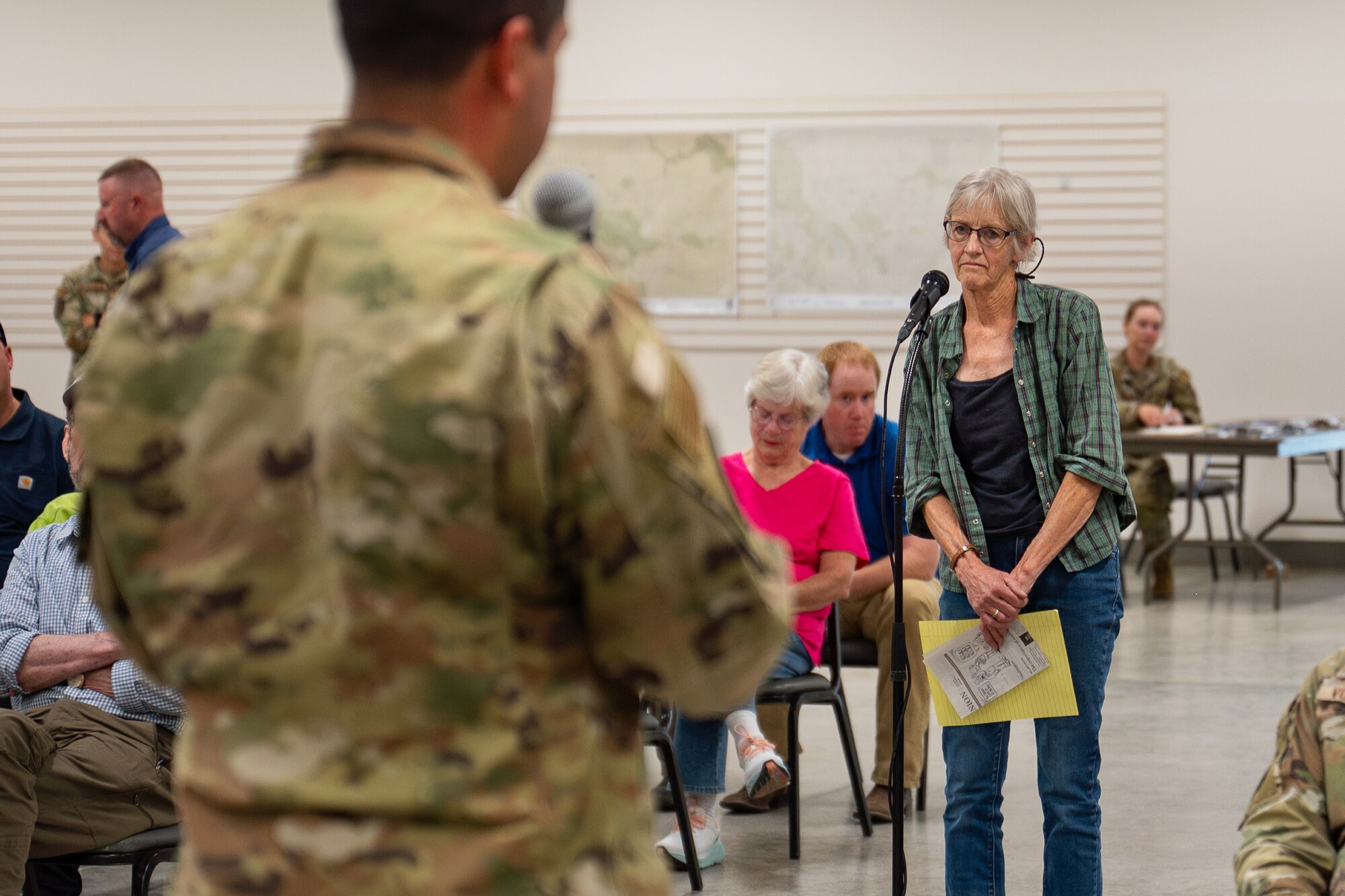 Uniformed personnel interact with members of the community.